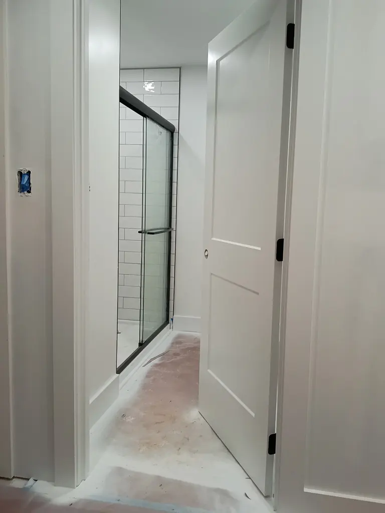 Subway tile shower with a glass door in a Knoxville, Tennessee bathroom