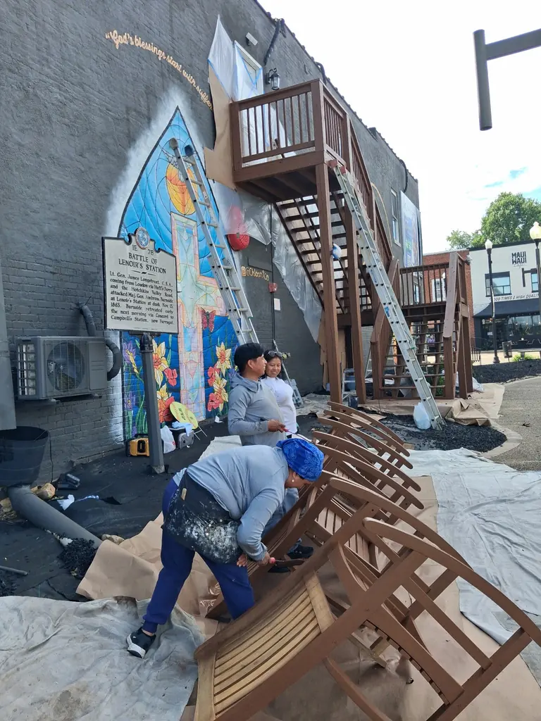 Downtown commercial building being repainted in Lenoir City, Tennessee