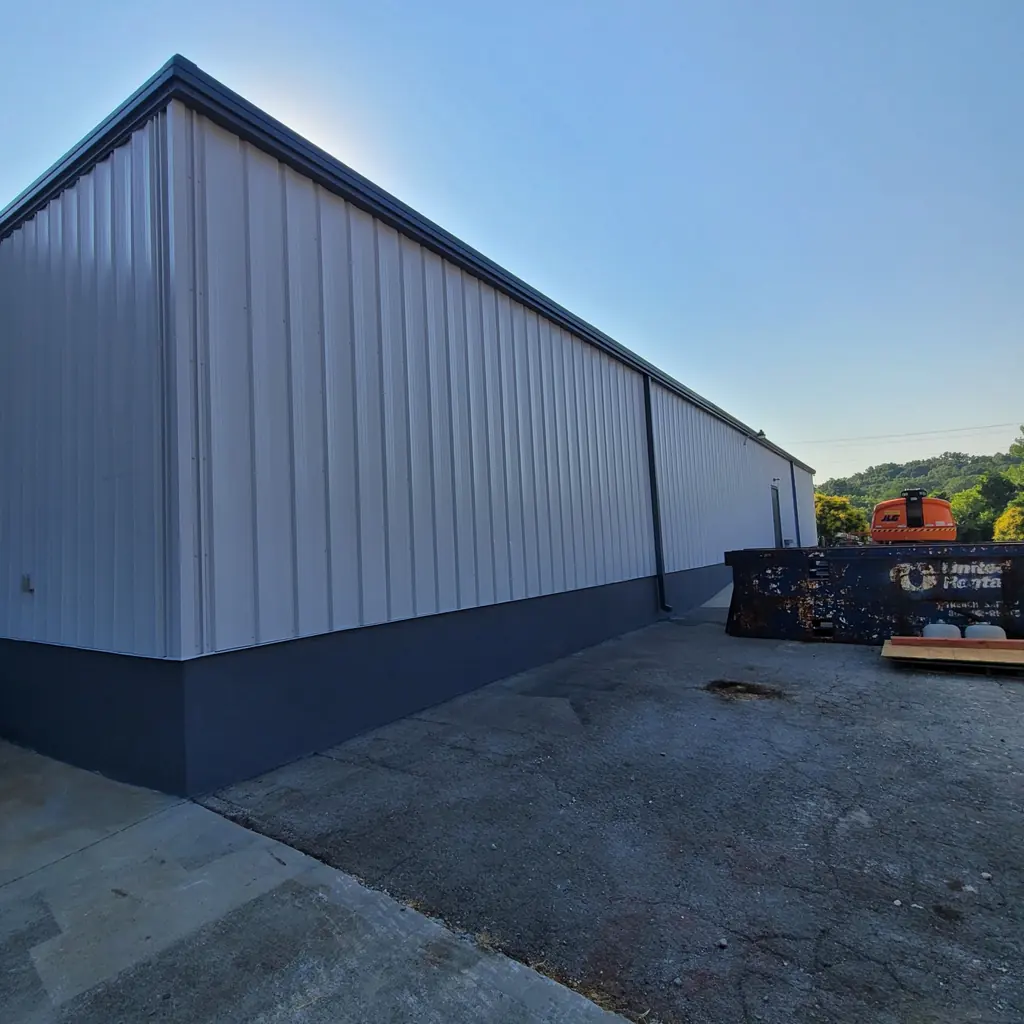 Metal building entrance and overhead door painted in Knoxville, Tennessee