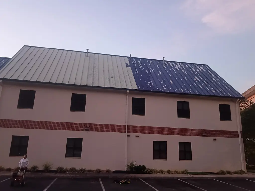 Faded and blotchy metal roof before recoating in Knoxville, Tennessee